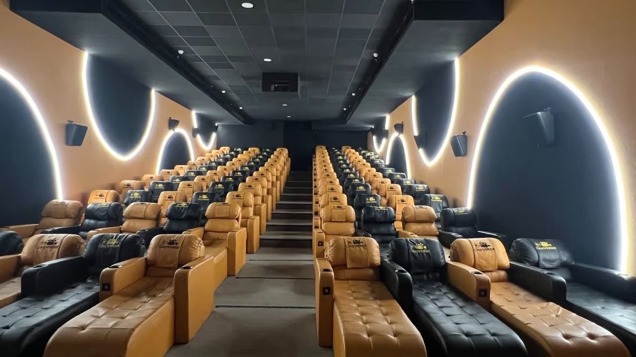 Cineverse Multiplex auditorium with arched cove lighting and premium recliners