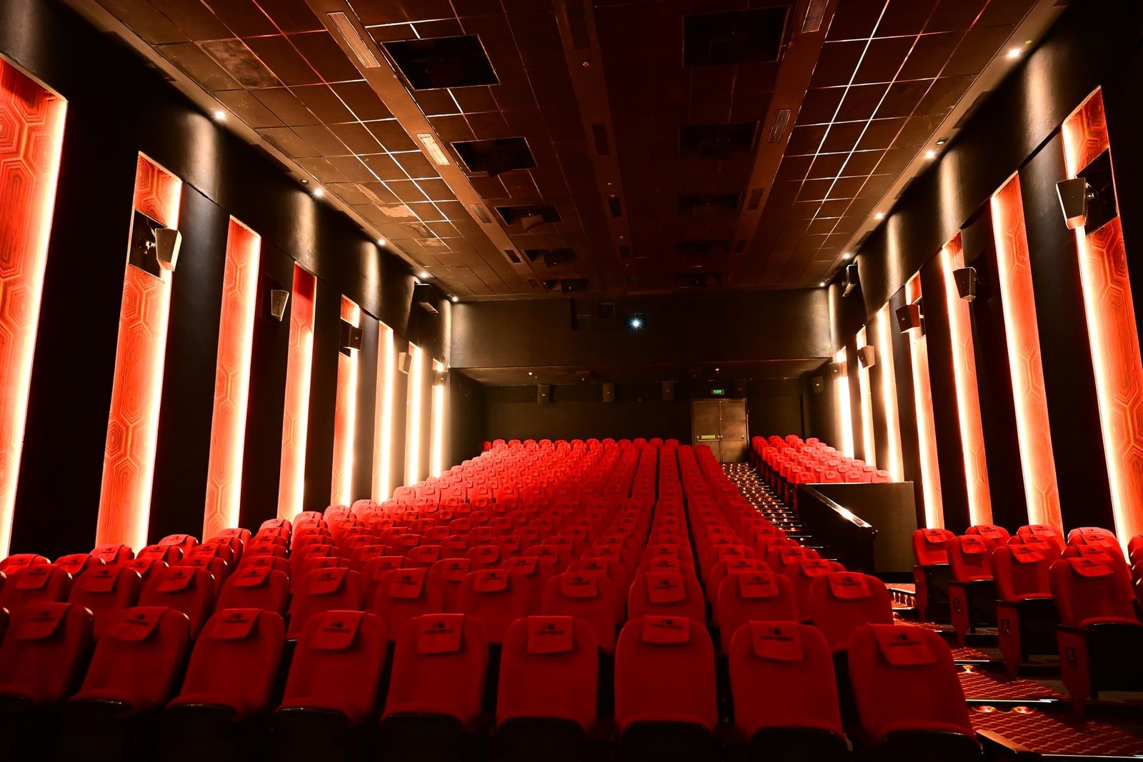 A full Cineverse Multiplex auditorium seen from the screen end