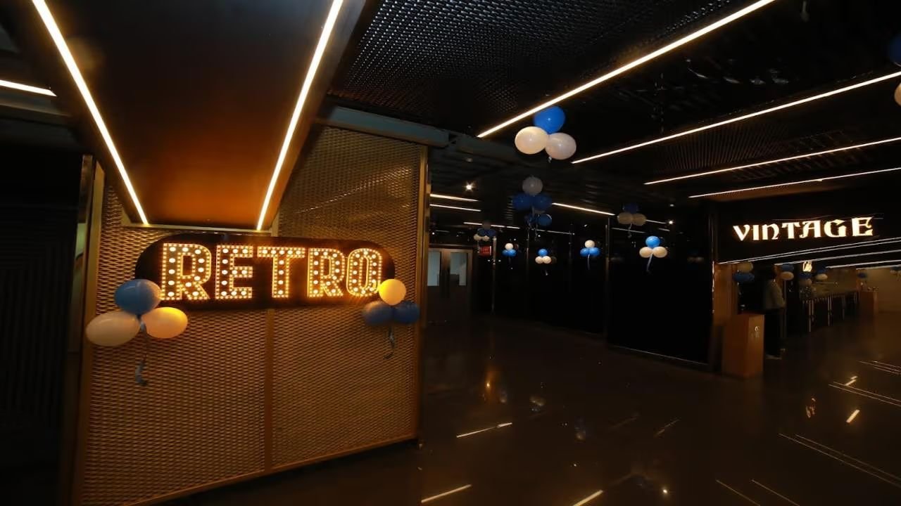 The Cineverse Multiplex lobby with the illuminated Retro and Vintage screen marquees